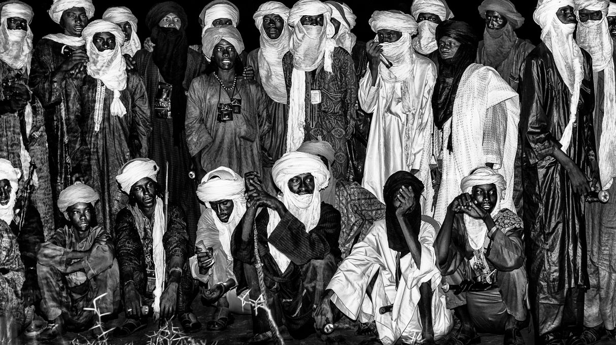 At night, in the heat of a bonfire in the gerewol festival - Niger Poster och Canvastavla