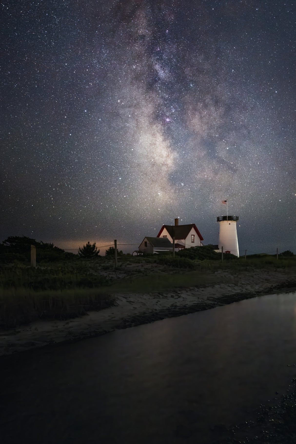 Milky way over the lighthouse Poster och Canvastavla