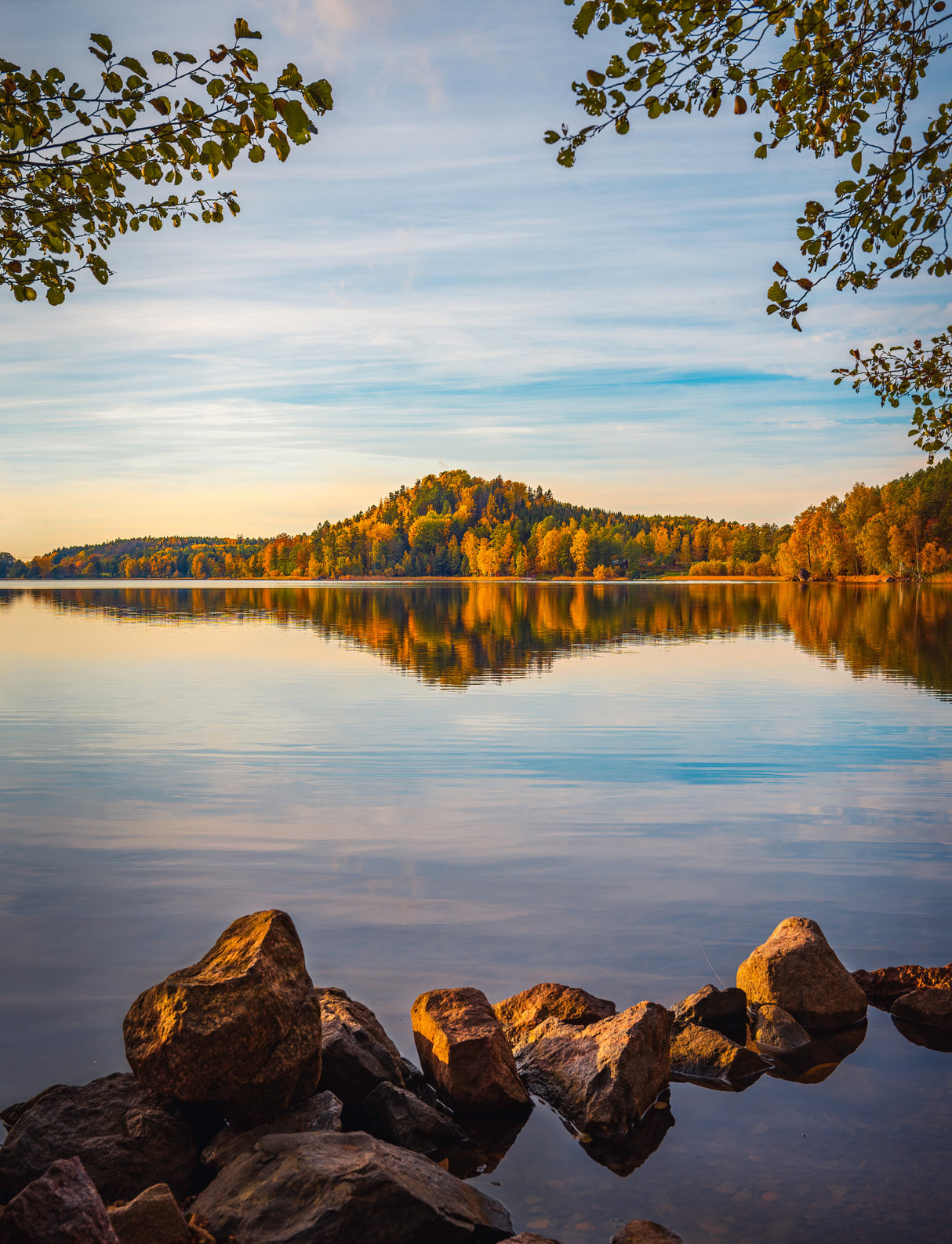 Autumn lake with a small mountain in the background Poster och Canvastavla