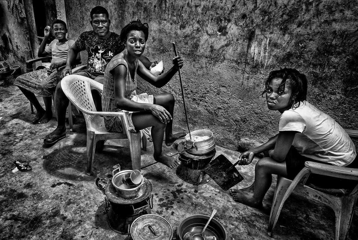 Preparing food on a street of the old Buduburam refugee camp - Ghana Poster och Canvastavla