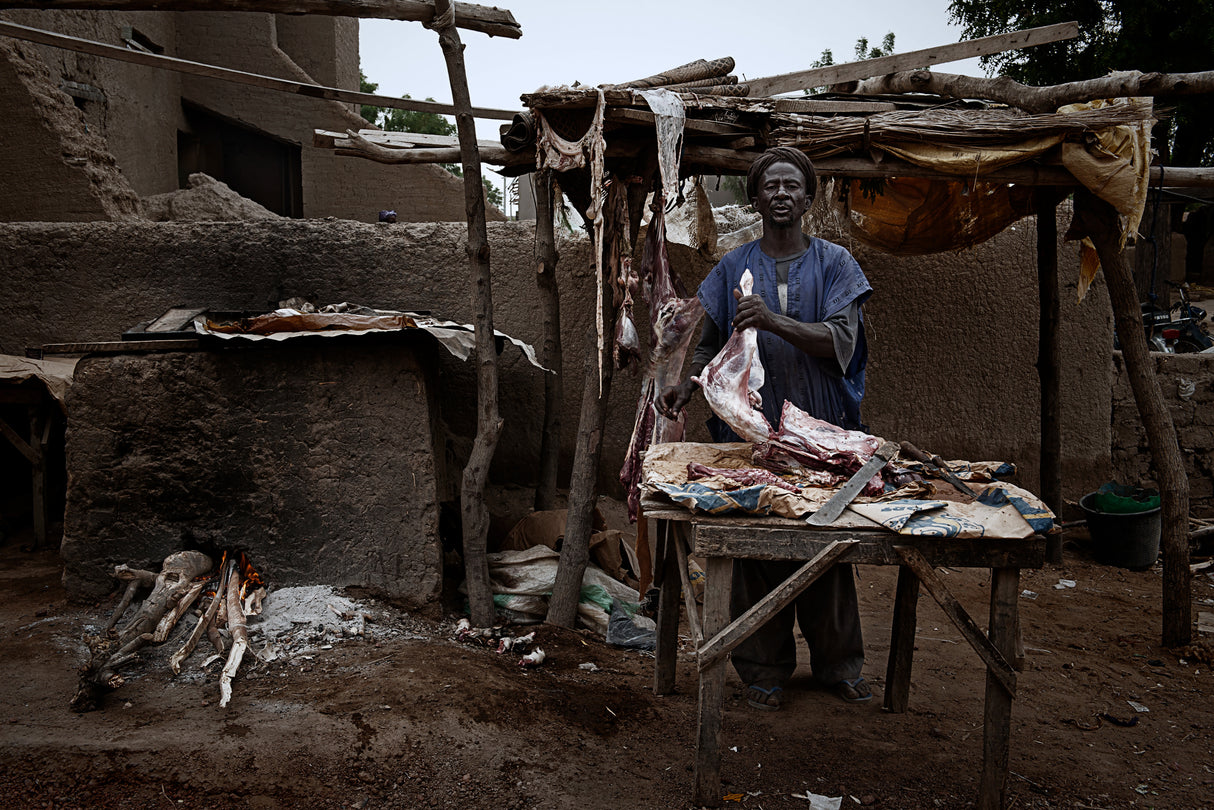 A butcher in the streets of Djenné - Mali Poster och Canvastavla