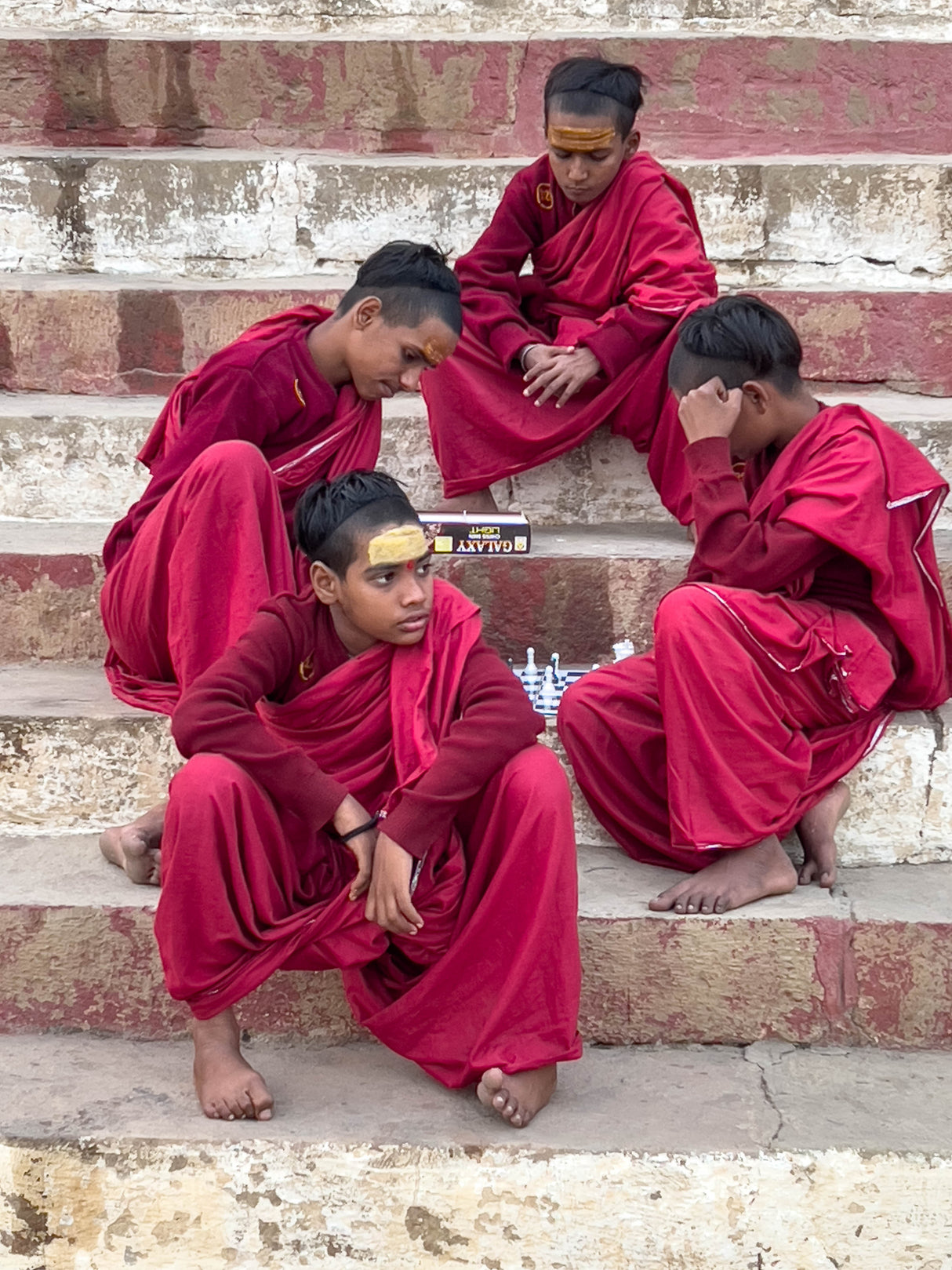 Young monks playing chess Poster och Canvastavla