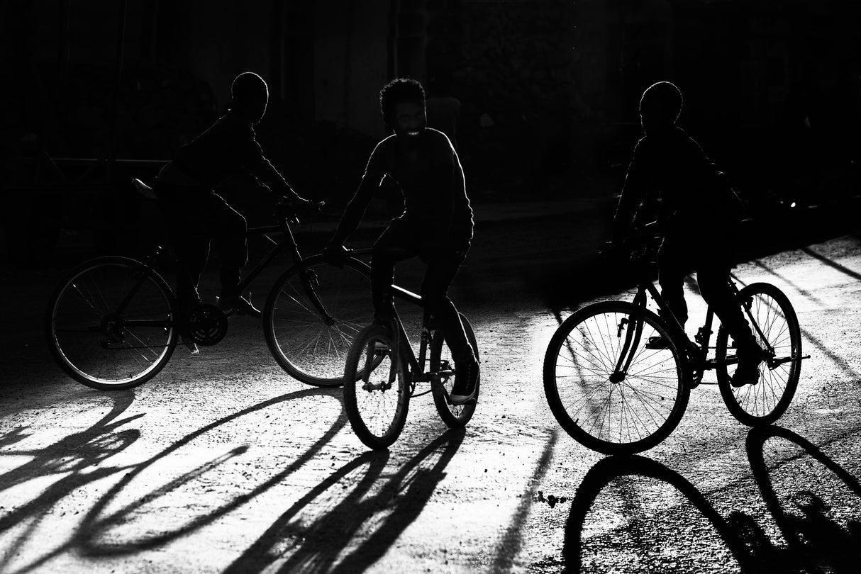 Boys, bycicles, shadow and light Poster och Canvastavla
