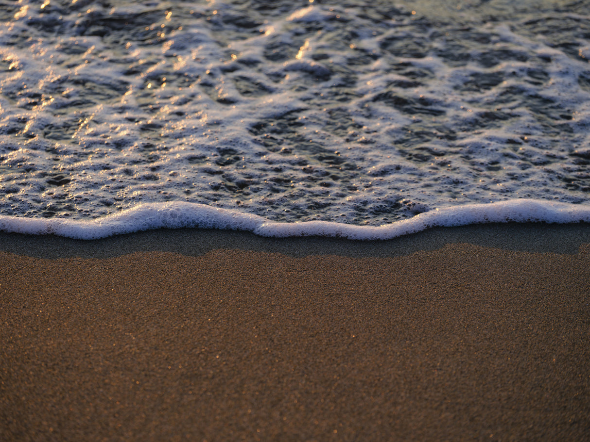 sea waves on the beach at sunset Poster och Canvastavla