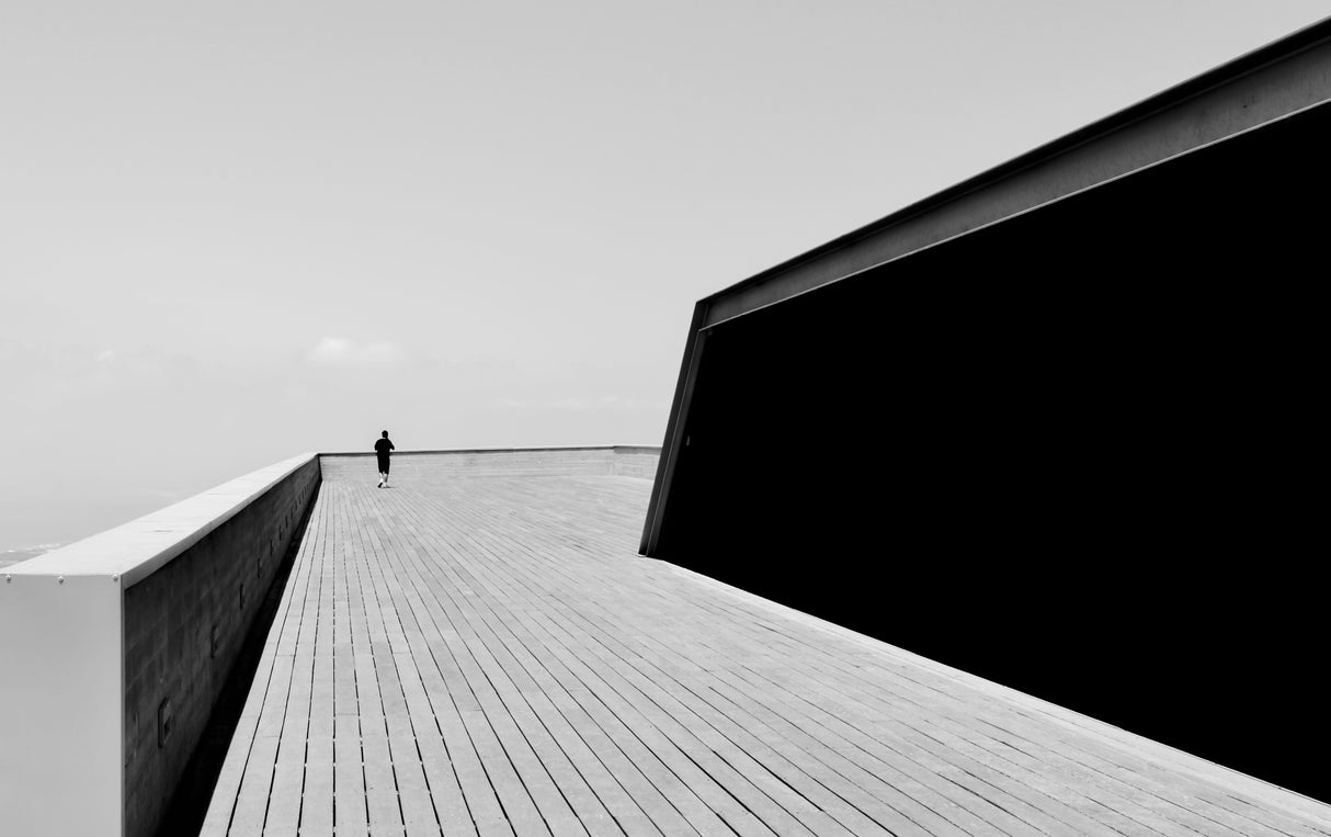 Man on wooden terrace BW Poster och Canvastavla