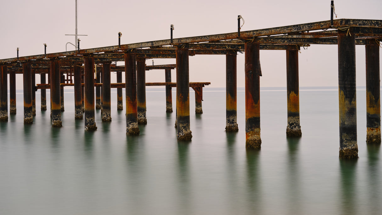 old pier on the beach and long exposure sea waves Poster och Canvastavla