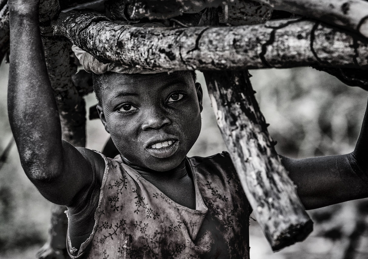 Somba tribe child carrying some wood - Benin Poster och Canvastavla