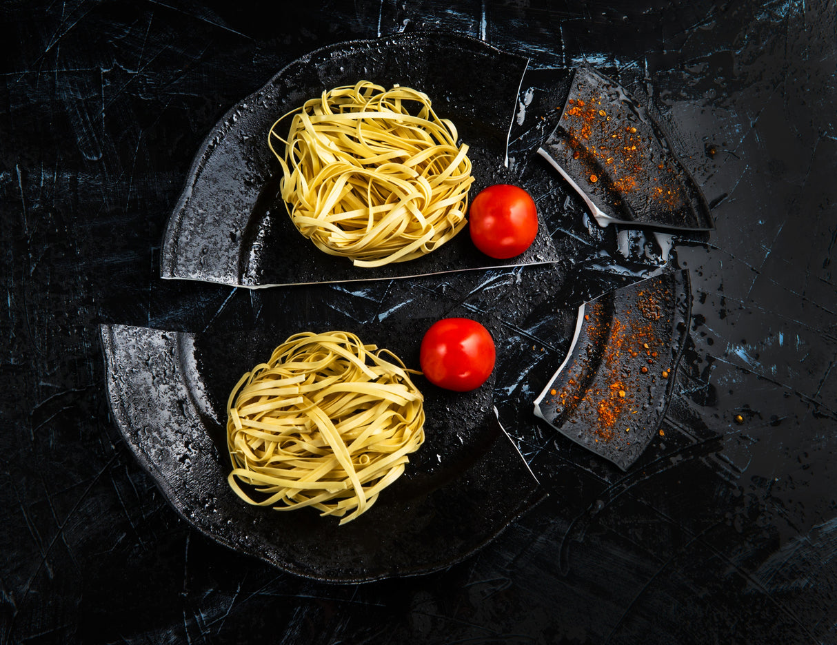 Italian pasta on a broken plate Poster och Canvastavla