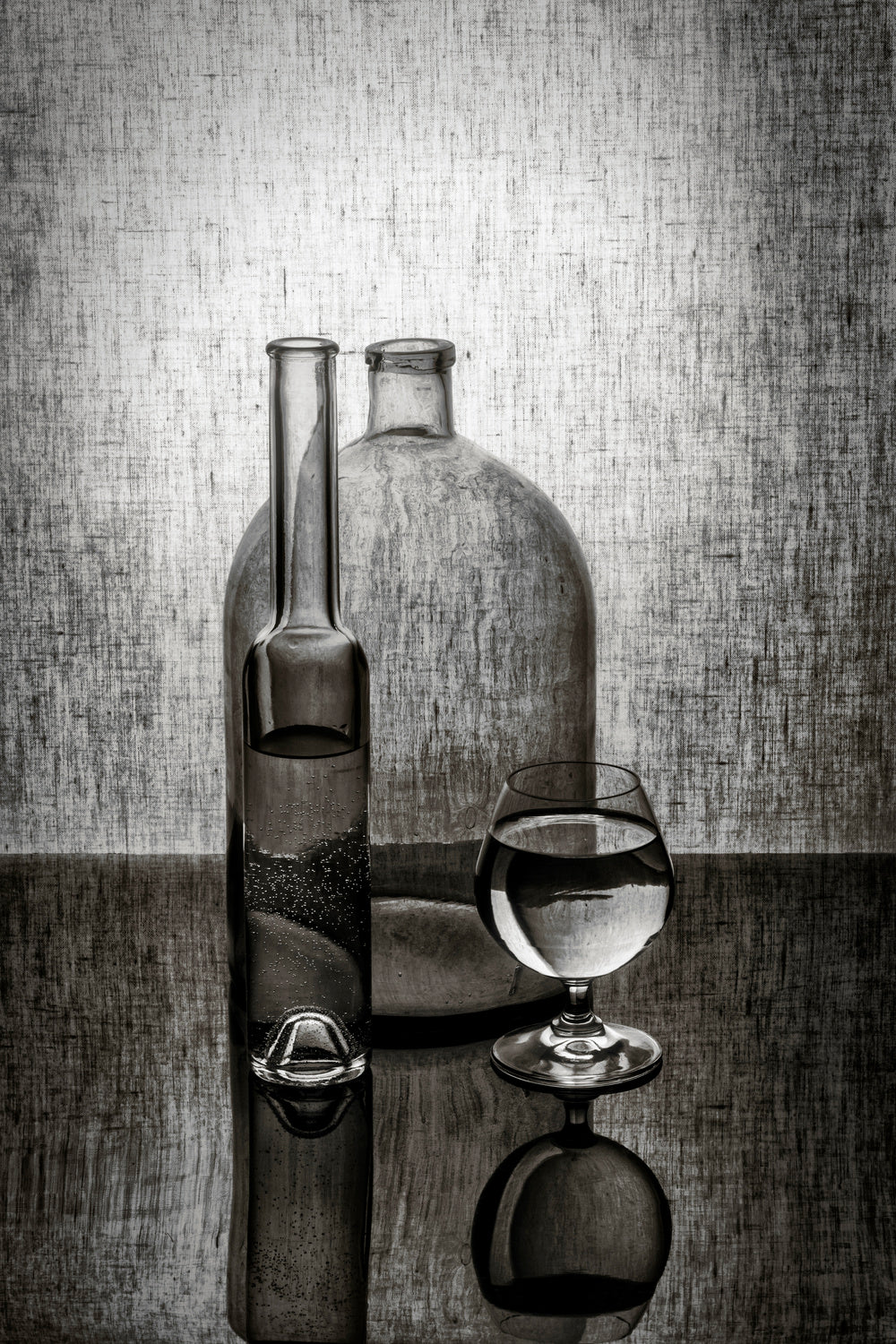 Still life with two bottles and a glass Poster och Canvastavla