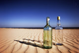 Bottles on sand Poster och Canvastavla
