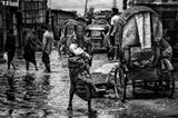 Man holding his child in the flooded streets of Bangladesh Poster och Canvastavla