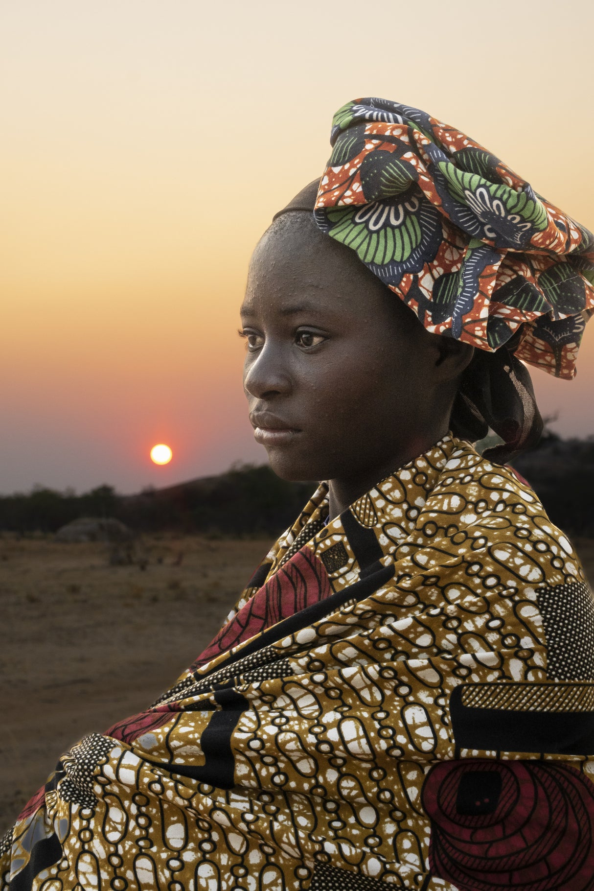 Sunrise in a Mukubal village, southern Angola Poster och Canvastavla