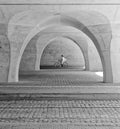 cyclists under the arches Poster och Canvastavla