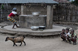 Drawing water from the well in a little village in Benin Poster och Canvastavla