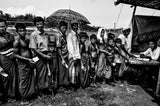 Rohingya refugees queuing to get some items to build their homes. Poster och Canvastavla