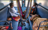An Indian family travelling by train Poster och Canvastavla