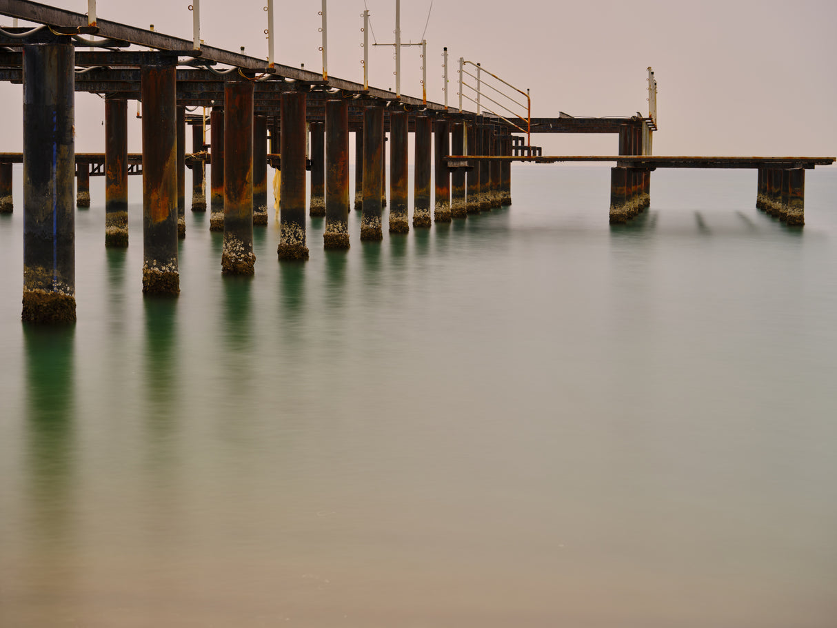 old pier on the beach and long exposure sea waves Poster och Canvastavla