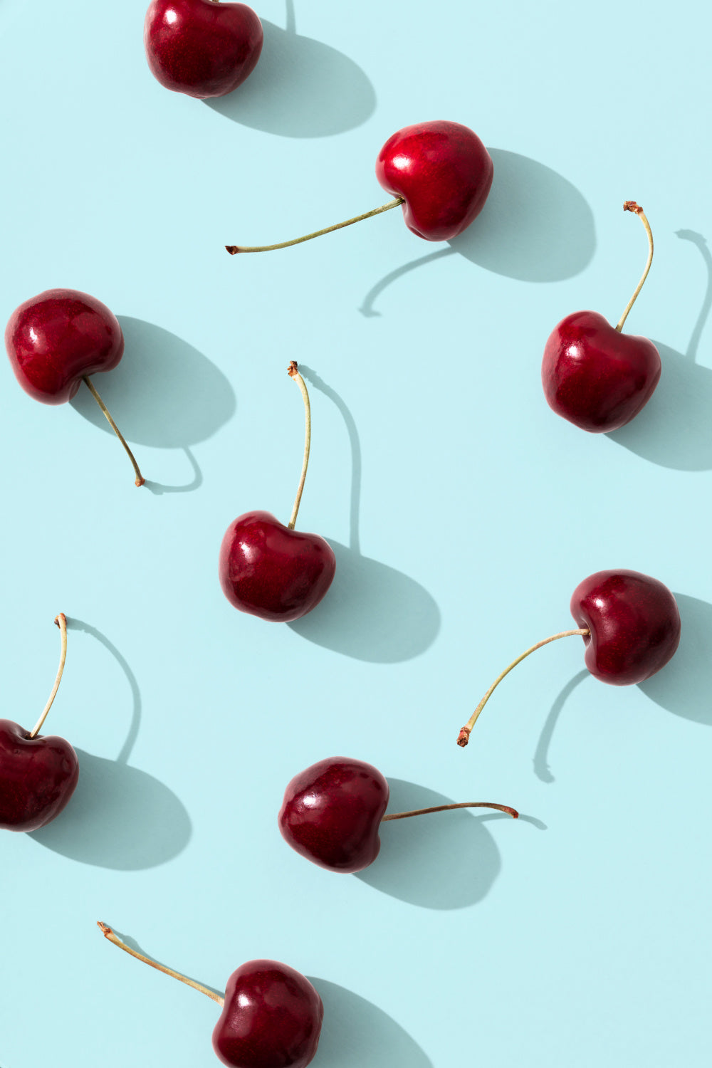 Cherries on turquoise background Poster och Canvastavla