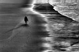Between sand and water, lonely woman Poster och Canvastavla