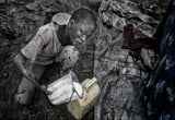 Mundari child passing the freshly milked milk to another container. Poster och Canvastavla
