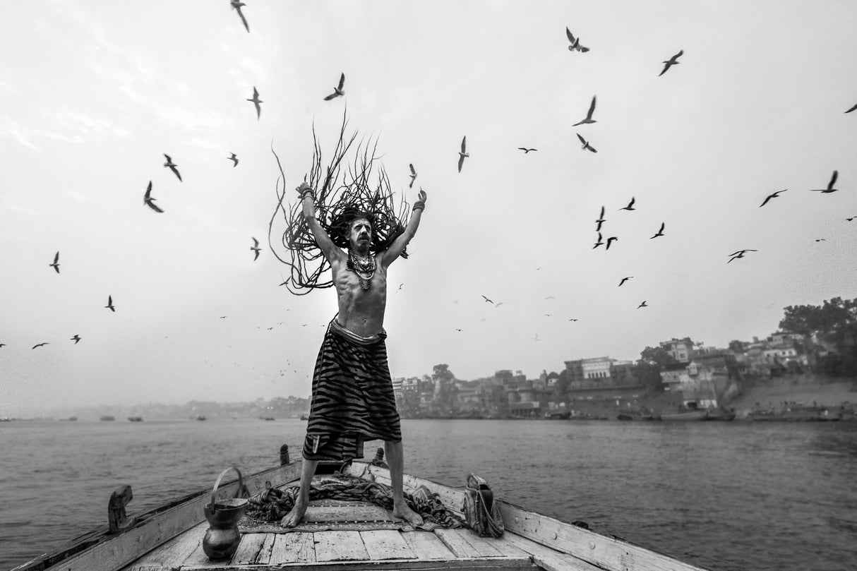 Naga Sadhu posing on boat at varanasi Poster och Canvastavla