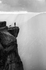 Woman and dog on cliff Poster och Canvastavla
