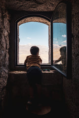 Little boy at the window Poster och Canvastavla