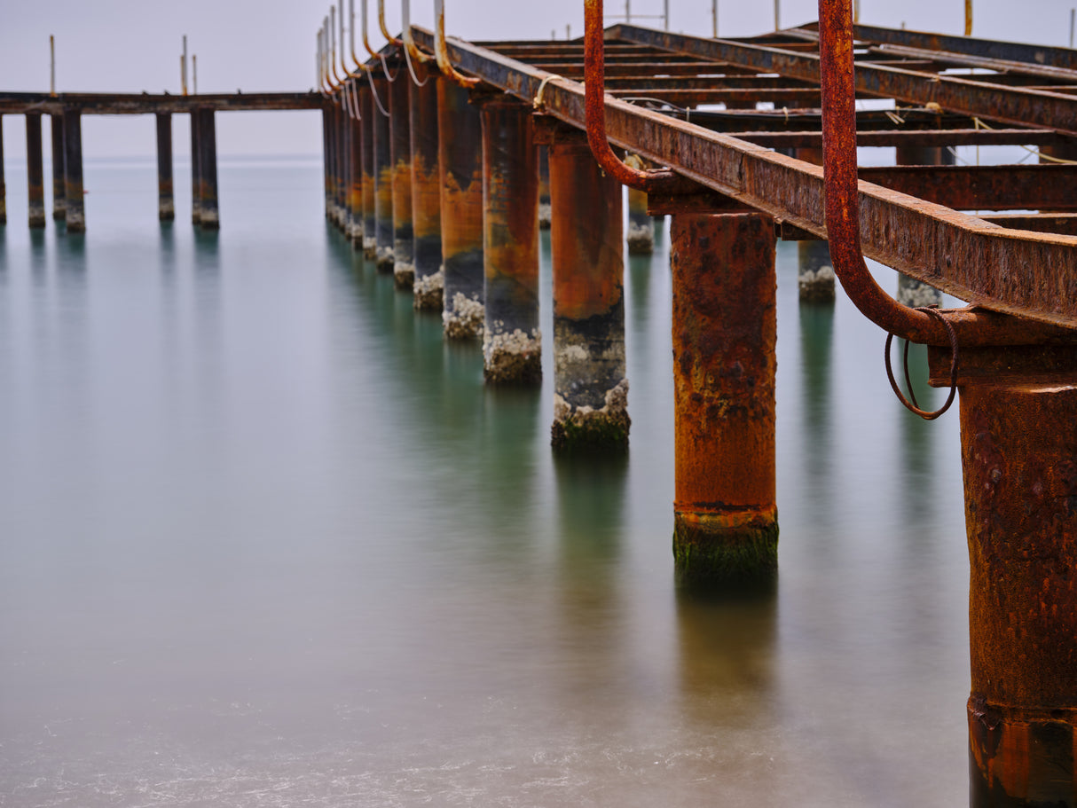 old pier on the beach and long exposure sea waves Poster och Canvastavla