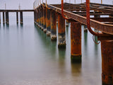 old pier on the beach and long exposure sea waves Poster och Canvastavla