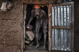 The village chief leaving his home - Benin Poster och Canvastavla