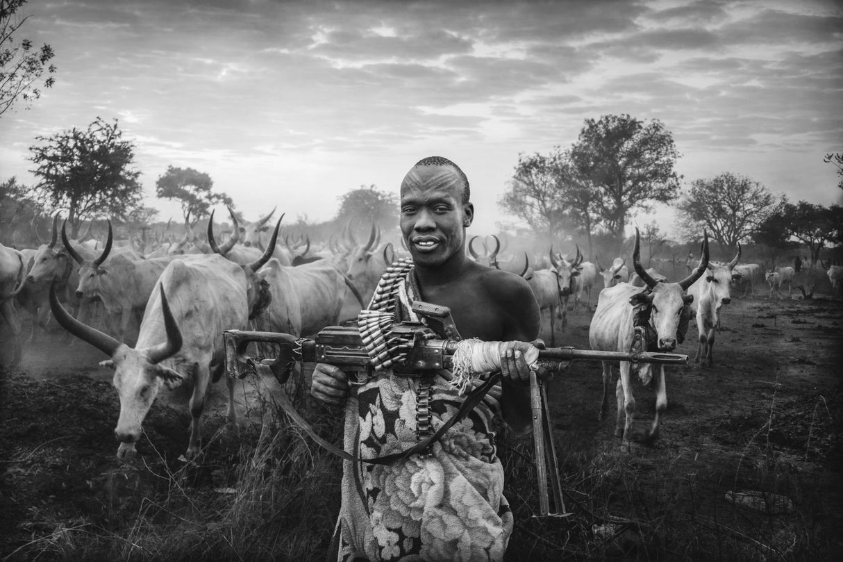 An armed man of the Mundari tribe Poster och Canvastavla