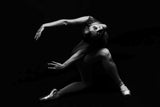 fracture. the ballerina is standing on pointe shoes leaning forward Poster och Canvastavla