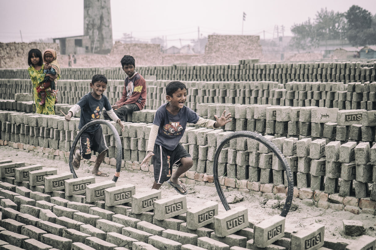 Children games at brickyard in Dhaka Poster och Canvastavla