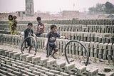 Children games at brickyard in Dhaka Poster och Canvastavla