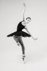 black swan. ballerina in a black tutu shows elements of ballet dance in motion Poster och Canvastavla