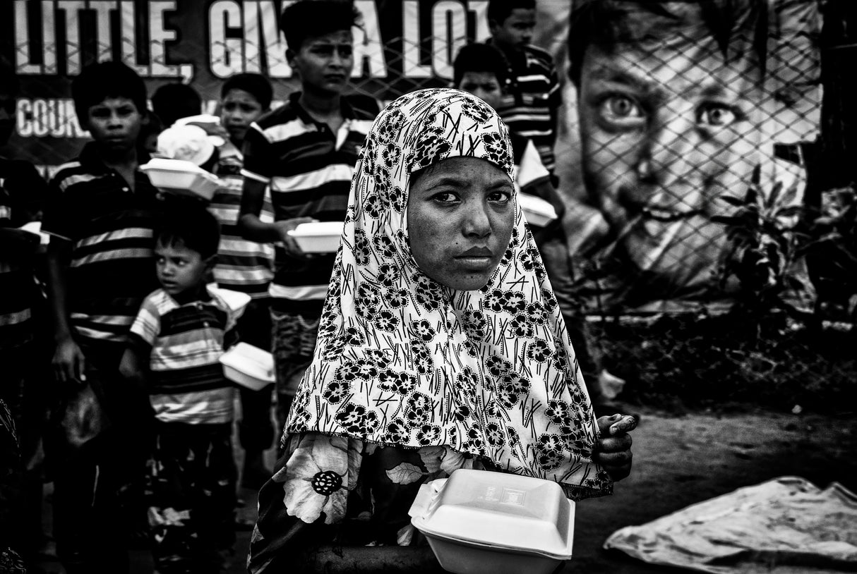 Distributing food in boxes to Rohingyas children: give a little. give a lot. Poster och Canvastavla