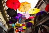 old building and decorative umbrellas Poster och Canvastavla