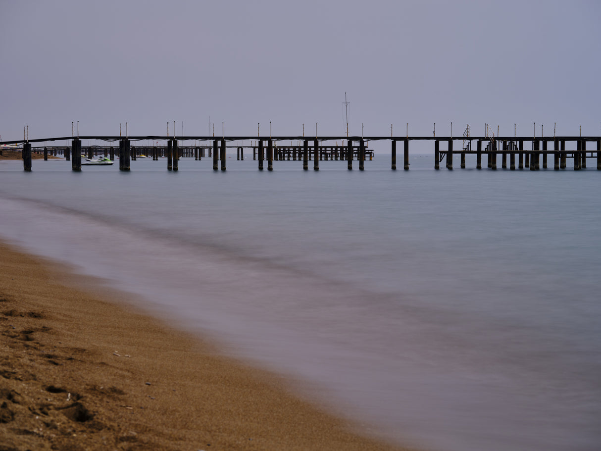 old pier on the beach and long exposure sea waves Poster och Canvastavla