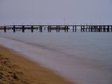 old pier on the beach and long exposure sea waves Poster och Canvastavla