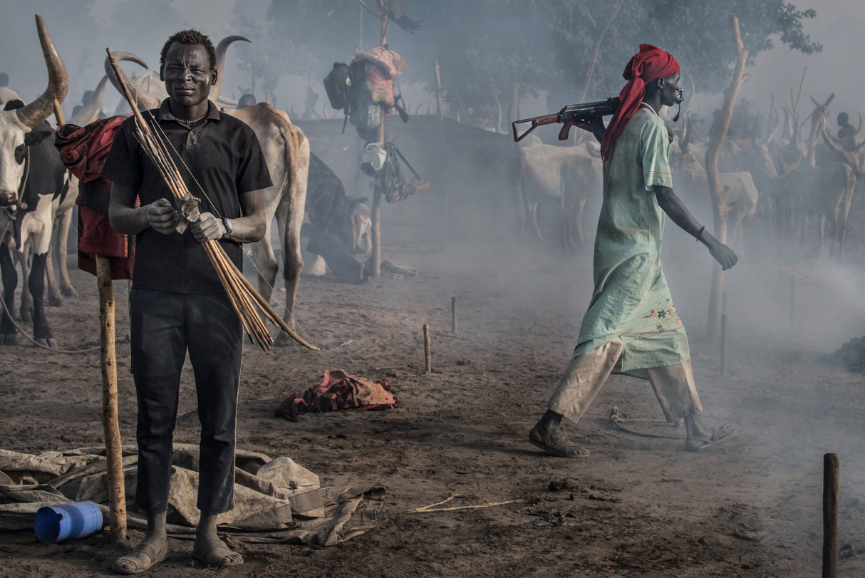 In a Mundari camp some use firearms while others use bows and arrows Poster och Canvastavla