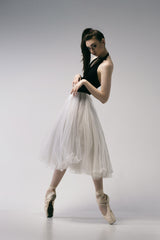 The coquetry. a young ballerina in a black skirt and Chopin is standing on pointe shoes Poster och Canvastavla