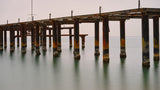 old pier on the beach and long exposure sea waves Poster och Canvastavla