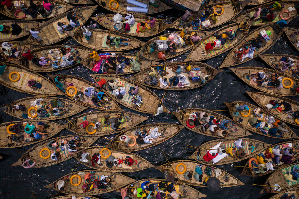 Boats filled with travelers crossing the river to their workplace Poster och Canvastavla