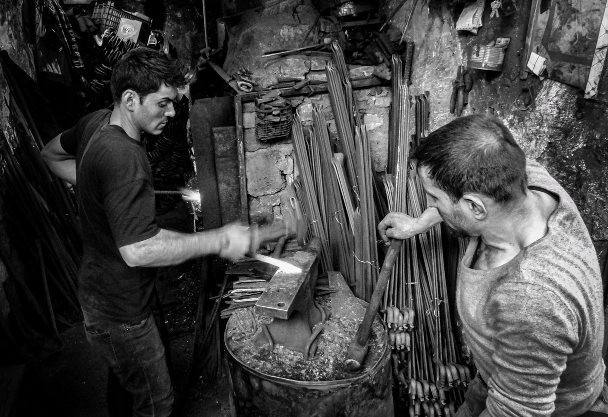 The traditional blacksmithing profession in the city of Mosul Poster och Canvastavla