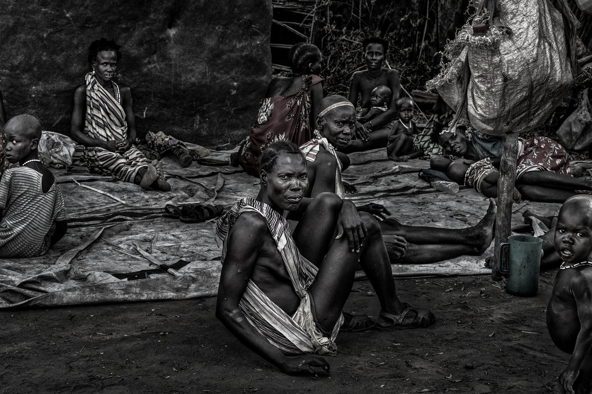 South Sudanian people having a rest near a market. Poster och Canvastavla
