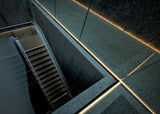 warm light in a cold staircase Poster och Canvastavla