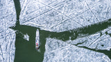Boat on icy lake Poster och Canvastavla