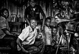 In a motorcycle repair shop - Benin Poster och Canvastavla