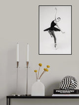 black swan. ballerina in a black tutu shows elements of ballet dance in motion Poster och Canvastavla