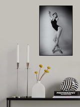 ballerina in a bodysuit improvises classical and modern choreography in a photo studio Poster och Canvastavla